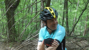Charlie Codrington, founder of Hidden racks Cycling, riding his mountain bike in spring woods