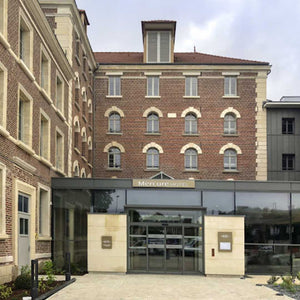 Gravel bike ride from London to Paris showcasing the exterior of Hotel Mercure Beauvais, a stylish stop along the route.