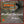 Load image into Gallery viewer, Bunch of Gravel riders cycling along an old railway track cycle path on a grey day.