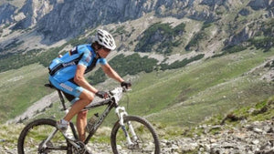 Charles Codrington founder of Hidden tracks Cycling racing his mountain bike in Romania 