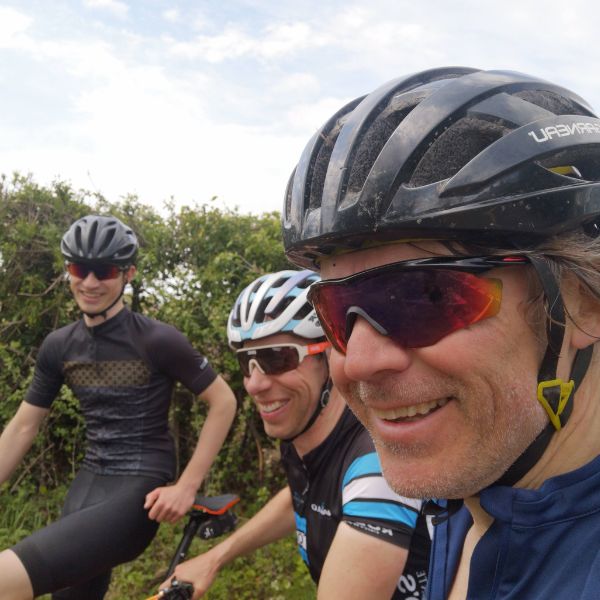 Group of 3 cyclists setting off on an all day adventure