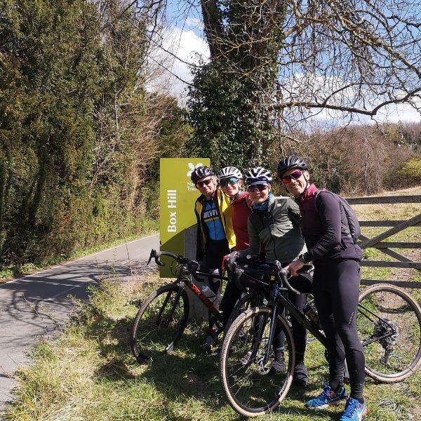 Group of 4 cyclists a the foot of the Box Hill Gravel Climb