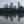 Load image into Gallery viewer, Canary Wharf reflected in the still water of the Thames at low tide from Tidal Explorer, a traffic-free  gpx bike route from Hidden Tracks Cycling