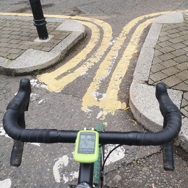 Impossible road markings – double yellow no parking lines on both sides of a narrow cycle route as seen on Hidden Tracks Cycling’s Pilgrimage to St Albans Gravel bike route