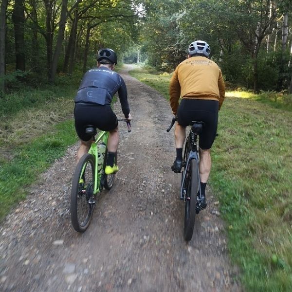 Pair of off-road cyclists enjoying the trails on Hidden Tracks Cycling’s off-road bike exploring the Tillingbourne Valley in Surrey