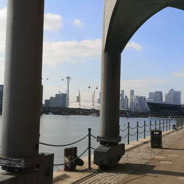 The old cranes at the Royal Docks seen from Tidal Explorer, a traffic-free  gpx bike route from Hidden Tracks Cycling
