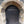 Load image into Gallery viewer, Arched shape ancient black wooden door t with ‘Commit no nuisance ‘ written on it in white paint as seen on Hidden Tracks Cycling’s Pilgrimage to St Albans Gravel bike route