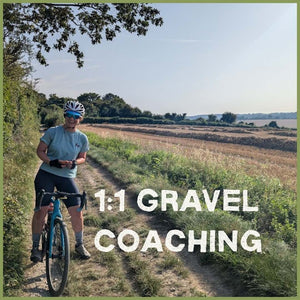 Female Gravel riding on a gravel trail alongside a freshy harvested golden cornfield.