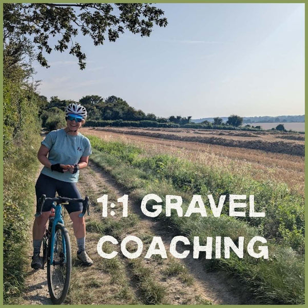 Female Gravel riding on a gravel trail alongside a freshy harvested golden cornfield.