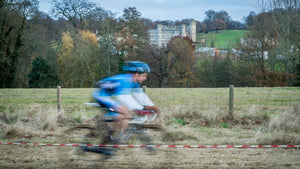 Cyclo Cross rider racing past Leeds Castle 