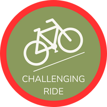 Icon of cycle riding up hill surrounded by red border, indicating a Hidden Tracks Cycling Challenging or red grade ride or Gravel GPX Route.