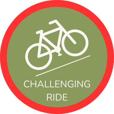 Icon of cycle riding up hill surrounded by red border, indicating a Hidden Tracks Cycling Challenging or red grade ride or Gravel GPX Route.