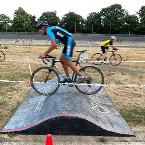 Cyclocross rider riding the humps during MAAP Summercross at Herne Hill Velodrome 