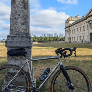 Landrace Gravel bike leaning against a pillar in the old Royal Naval Hospital Greenwich at the start of Hidden Tracks Cycling's Trail of Two Cities gravel tour from London to Paris 