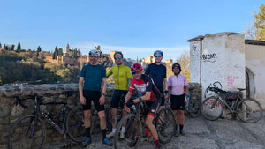Group of gravel cyclists with their bicycles over looking the Alhambra palace Granada.