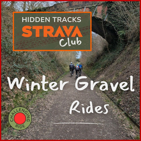 Bunch of Gravel riders cycling along an old railway track cycle path on a grey day.