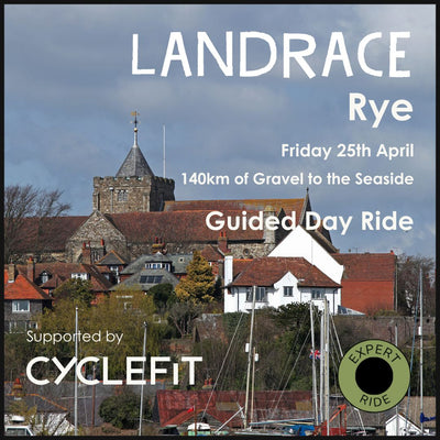 A medieval church tower overlooks the sailing boats of the River Rother a on Hidden Tracks Cycling's Landrace gravel bike ride to Rye. 