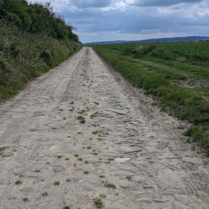 Section of old pave or cobbled rural road in Picardy just north of Paris on the Hidden Tracks Cycling Trail of Two Cities gravel ride from London to Paris 