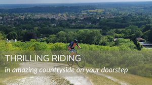 Cyclist riding across the North Downs on a mountain bike 