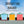 Load image into Gallery viewer, Brighton Bound bikepacking GPX route title card, featuring a row of colourful painted beach huts.
