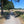 Load image into Gallery viewer, Gravel path between farmland and oak trees on the Brooklands GPX gravel bike route from London, Surrey.
