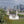 Load image into Gallery viewer, Old Royal Naval College towers in Greenwich with the Canary Wharf skyline behind, a highlight of this London bike ride
