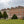 Load image into Gallery viewer, Hampton Court Palace's red-brick facade and topiary gardens, the starting point for this bike ride in London
