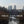Load image into Gallery viewer, Tidal Explorer title card: a traffic-free bike route through East London, with Canary Wharf rising above a Thames creek
