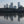 Load image into Gallery viewer, Canary Wharf reflected in the still water of the Thames at low tide from Tidal Explorer, a traffic-free  gpx bike route from Hidden Tracks Cycling  
