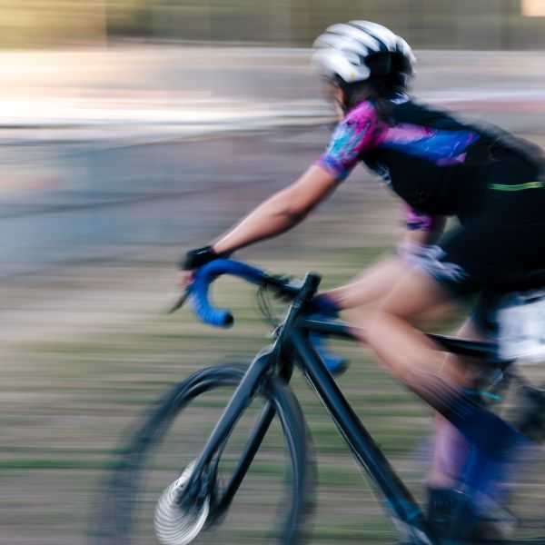 Cyclocross racer cornering at the MAAP Summercross race at Herne Hill - Image by Honor Elliot