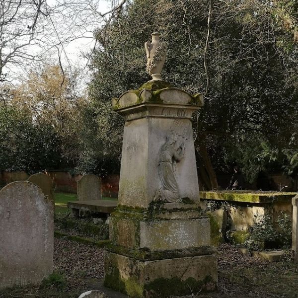 A weathered urn monument in an Ewell graveyard, passed along the Ophelia in the Hogs Mill route.
