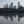 Load image into Gallery viewer, Canary Wharf reflected in the Thames at low tide
